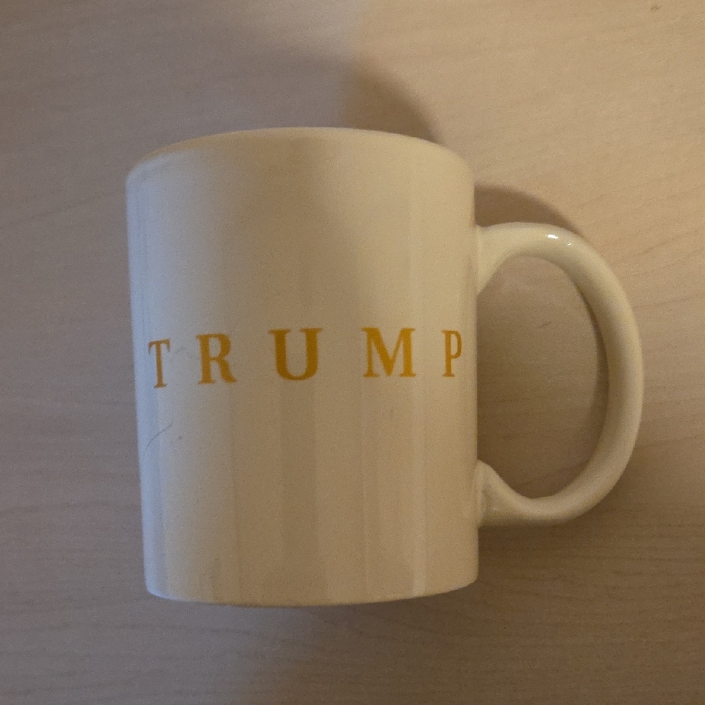 White Cup with Trump in Gold Letters